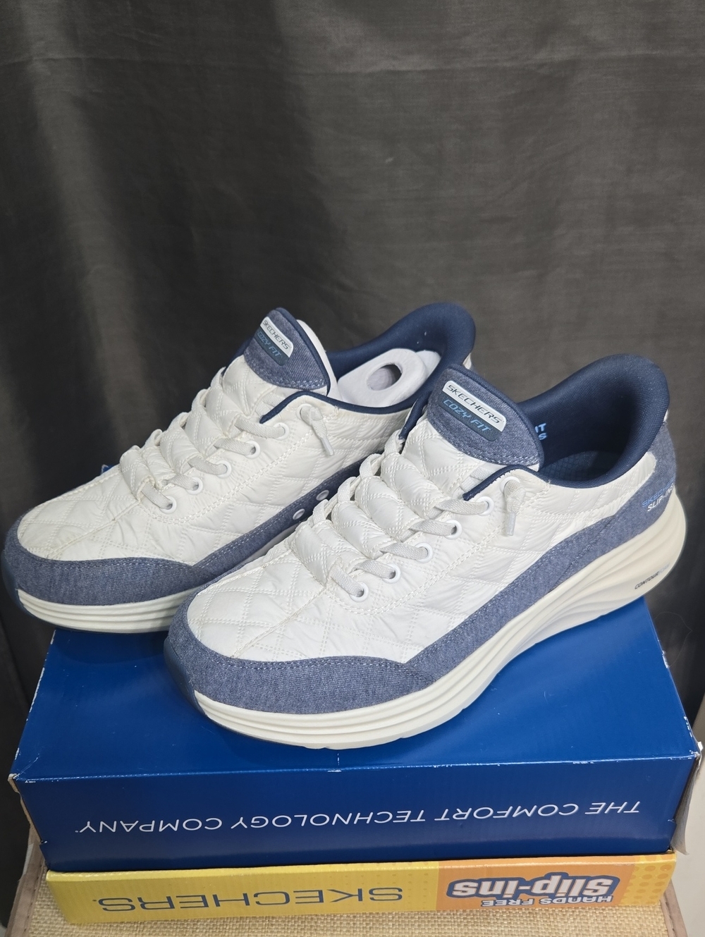 Skechers Women’s White and Navy Quilted Slip-On Style Sneaker